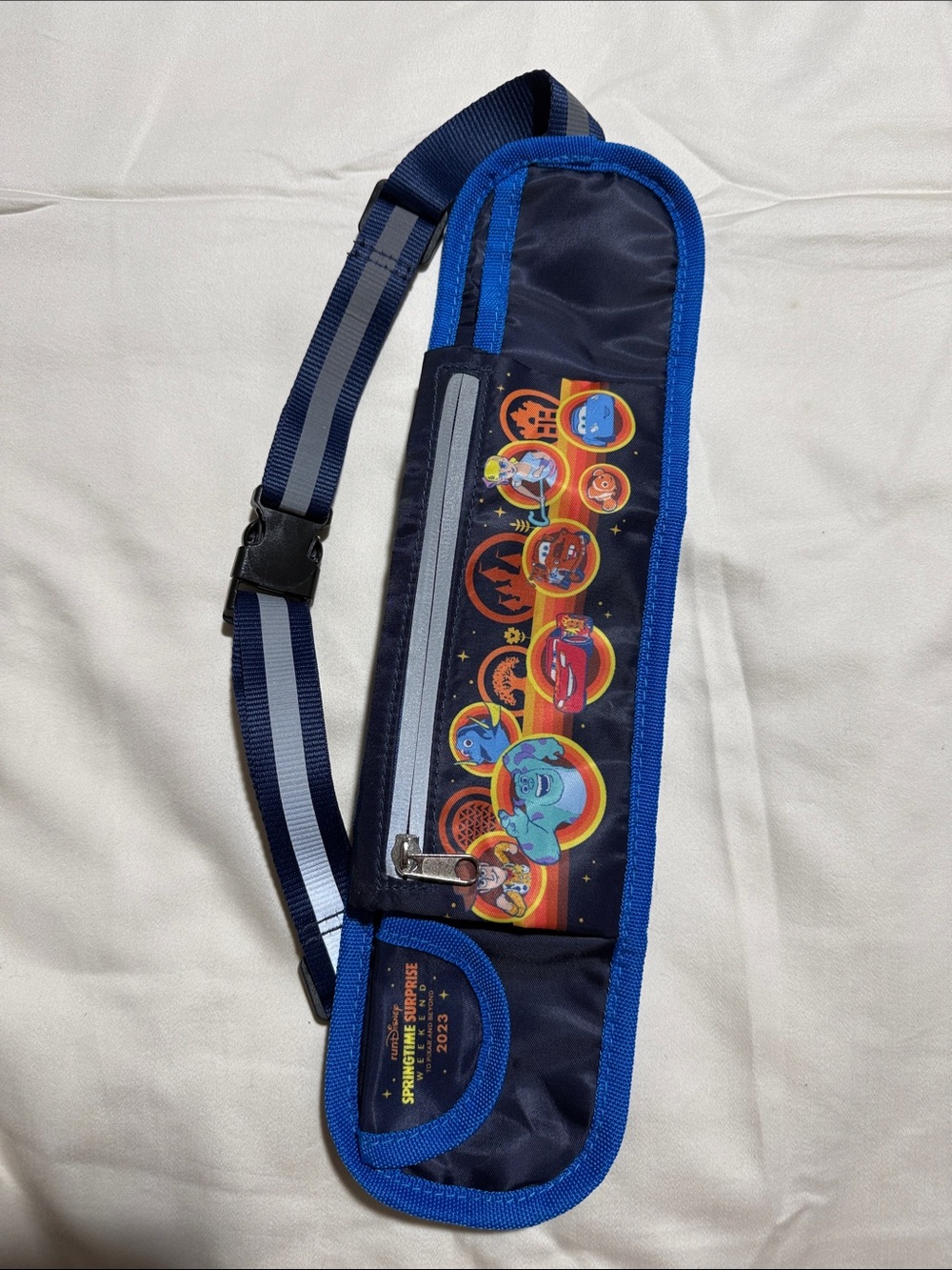 RunDisney Navy Blue Pixar Character Sling Bag with Rainbow Graphics from 2023
